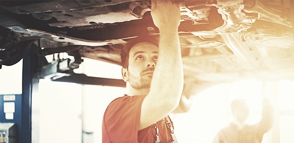 Mechanic-Examining-Car-Undercarriage Mechanic-Examining-Car-Undercarriage