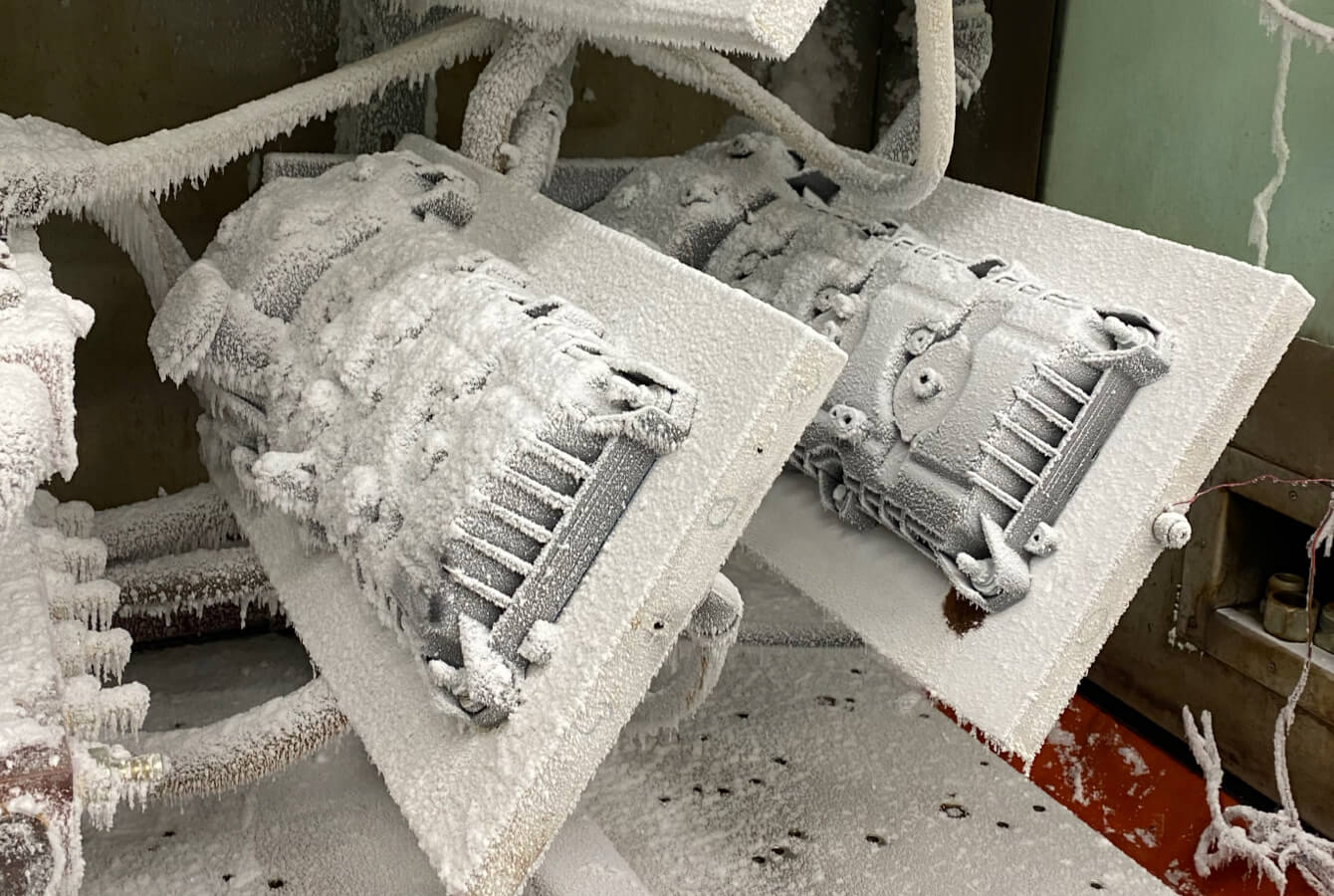 Simulating cold conditions to temperatures as cold as -40°F. Fel-Pro gasket in the foreground and OE gasket in the background. Simulating cold conditions to temperatures as cold as -40°F. Fel-Pro gasket in the foreground and OE gasket in the background.