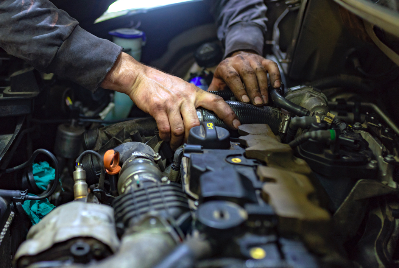 Mechanic Working On Car Engine Mechanic Working On Car Engine