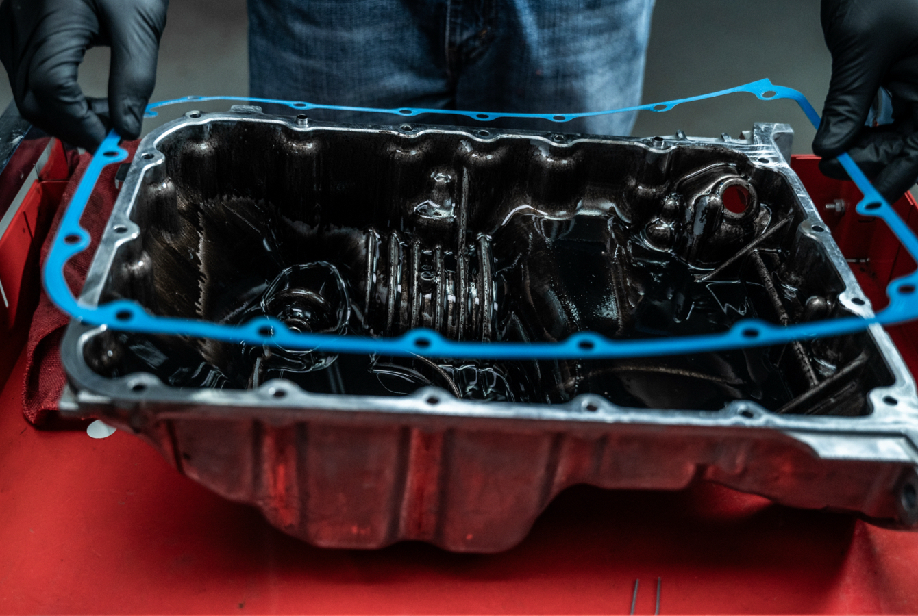 Auto Mechanic Installing Valve Cover Gasket Auto Mechanic Installing Valve Cover Gasket