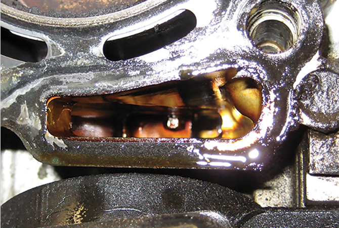 subaru-leaking-head-gasket-damage Close up view of the damage that an external leak can cause