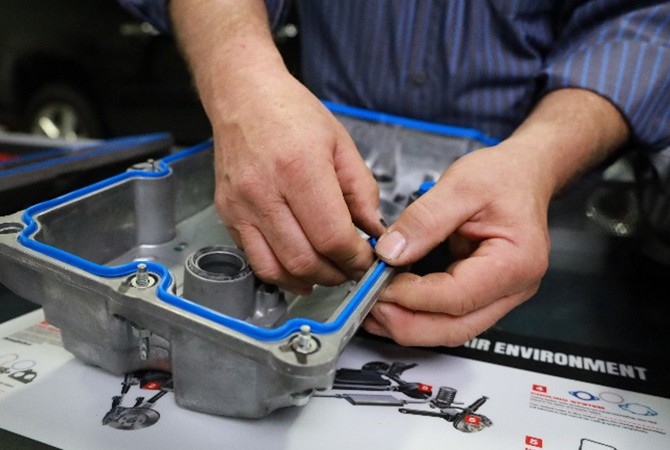 pressing-valve-cover-gasket-in-place Pressing valve cover gasket in place.