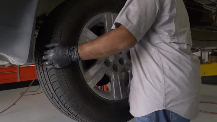 Removing tire from vehicle Removing tire from vehicle