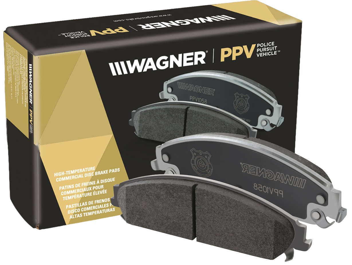 Two Wagner OEX brake pads in front of the box they came in