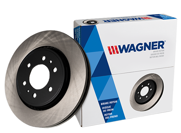 Two Wagner OEX brake pads in front of the box they came in