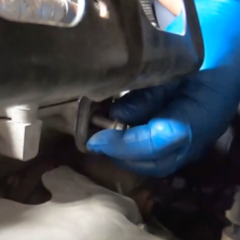step-3-technician-removing-engine-cover-bracket step-3-technician-removing-engine-cover-bracket