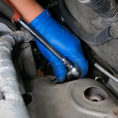 step-5-technician-removing-heat-shield step-5-technician-removing-heat-shield